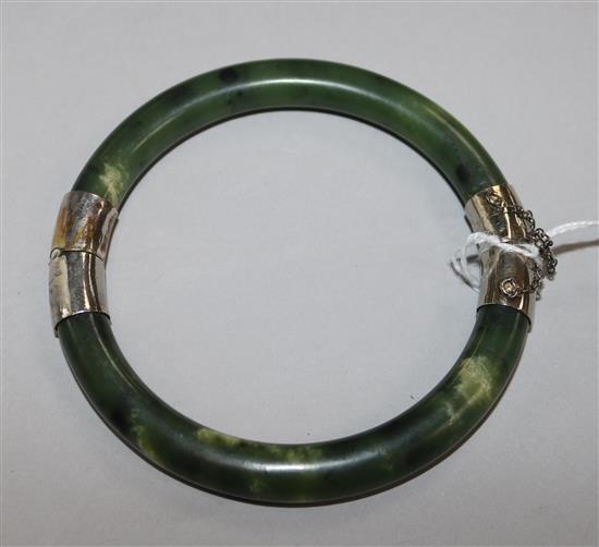 A spinach jade hinged bangle.